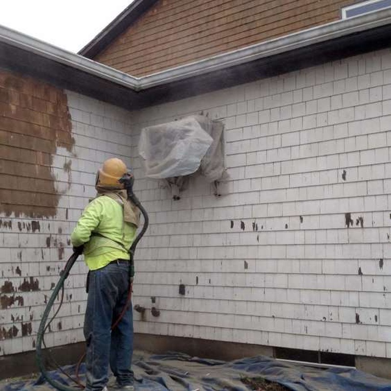 Stripping paint off of a wood house