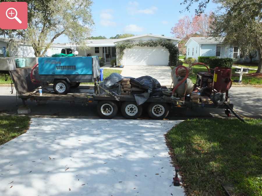 Sandblasting concrete driveway paint removal stripping