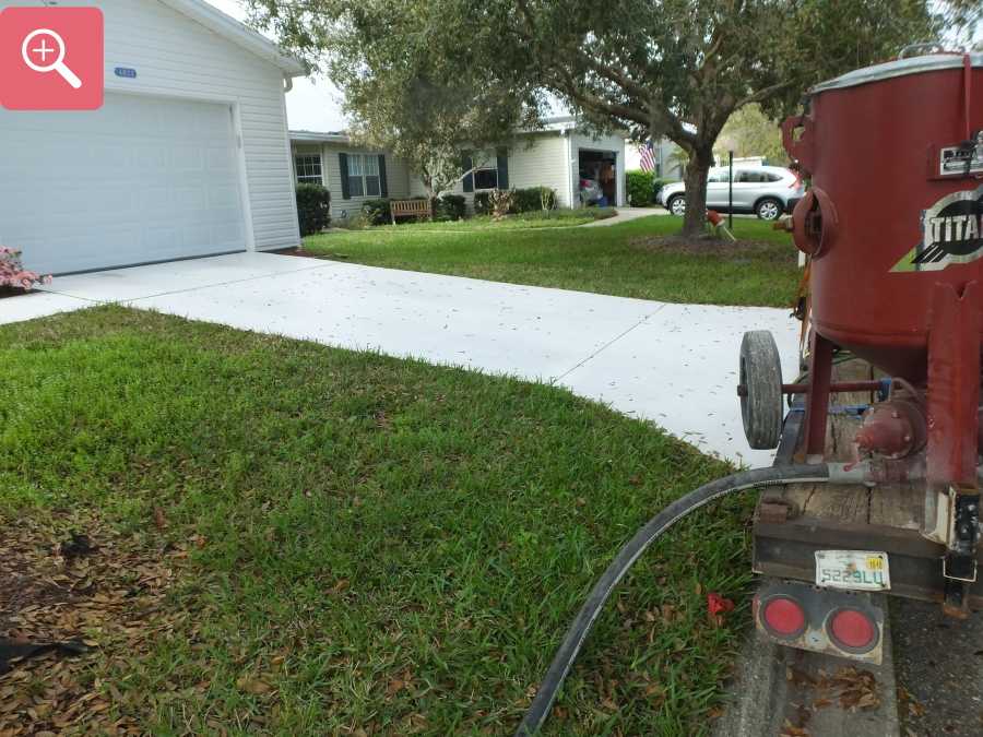 Sandblasting concrete driveway paint removal stripping