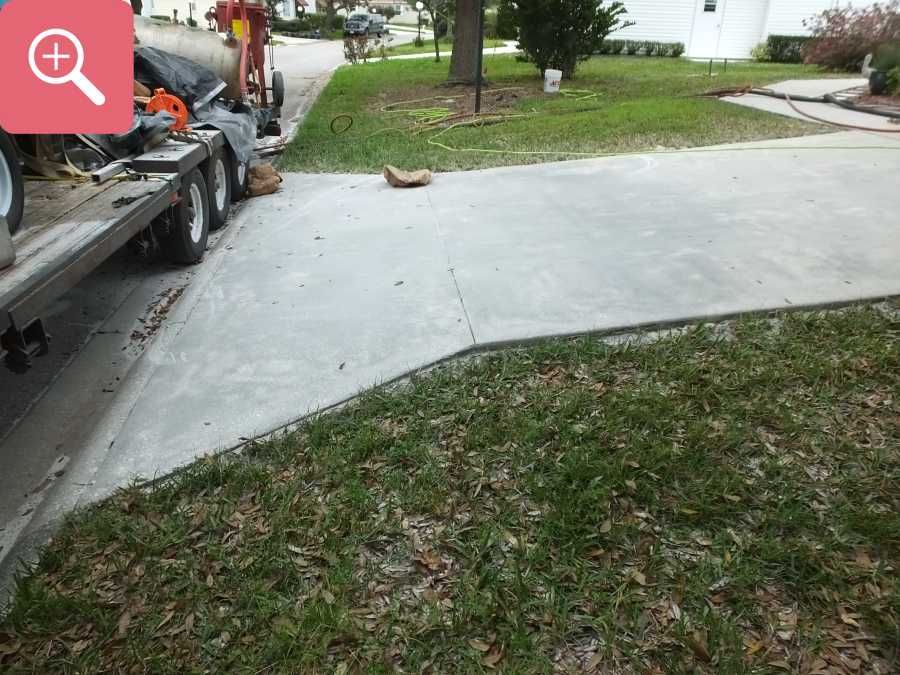 Sandblasting concrete driveway paint removal stripping