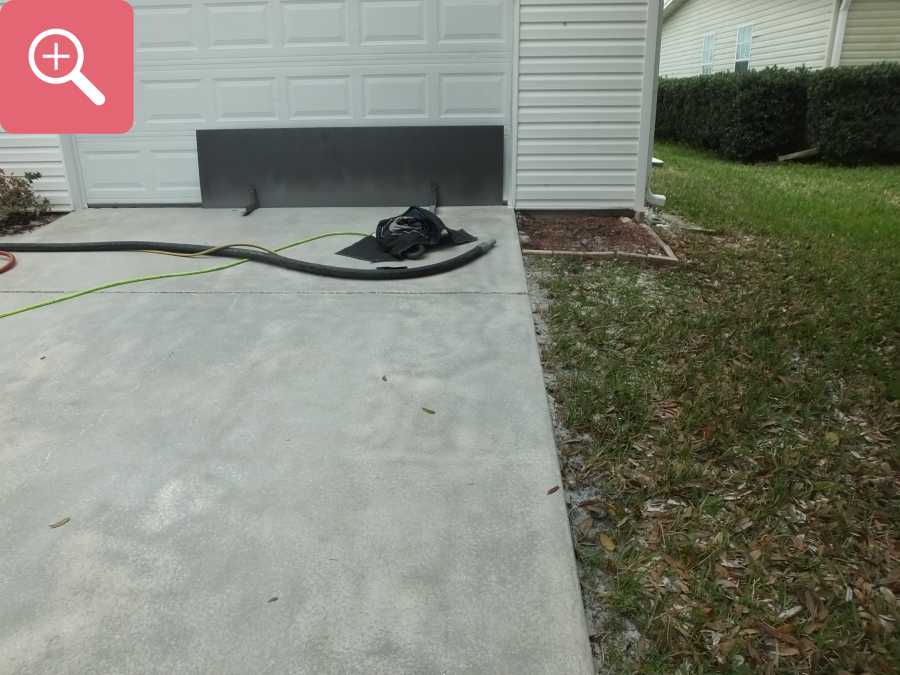 Sandblasting concrete driveway paint removal stripping