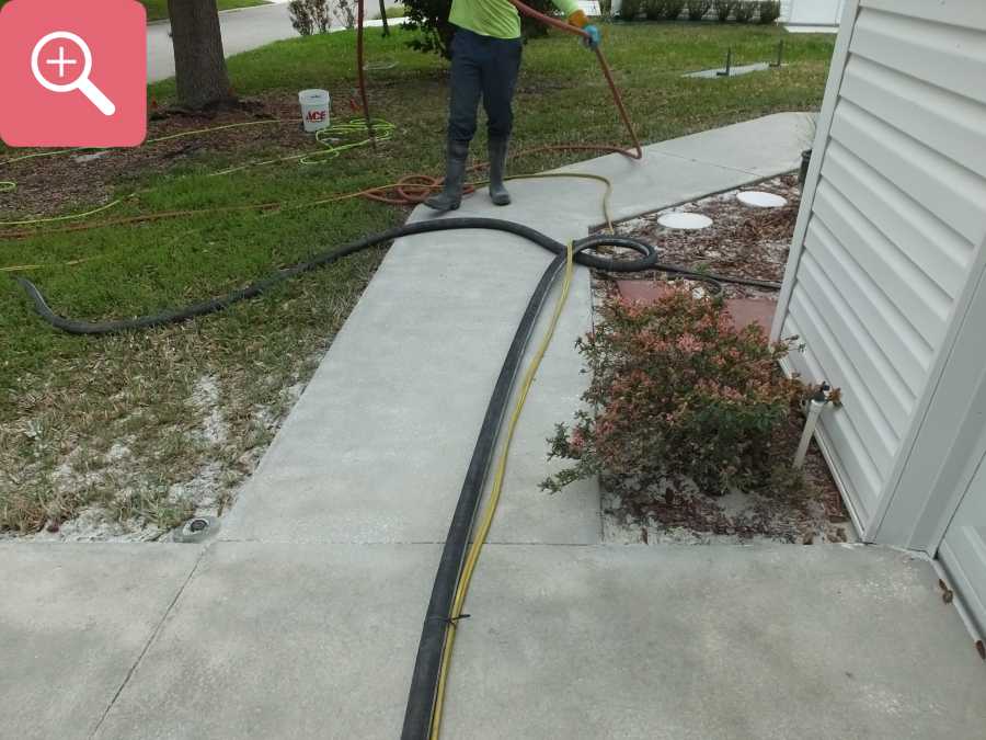 Sandblasting concrete driveway paint removal stripping