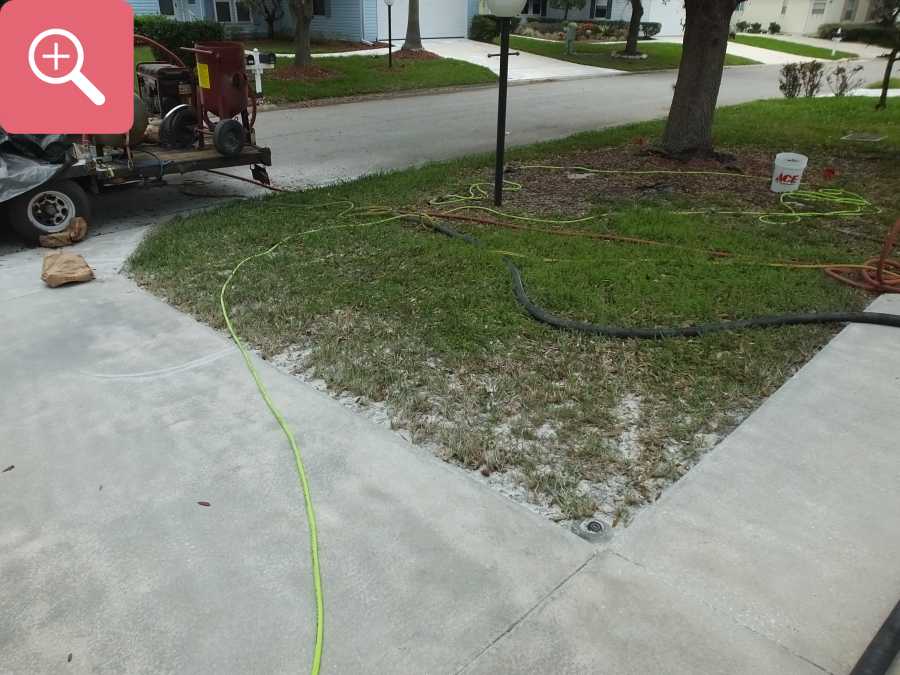 Sandblasting concrete driveway paint removal stripping