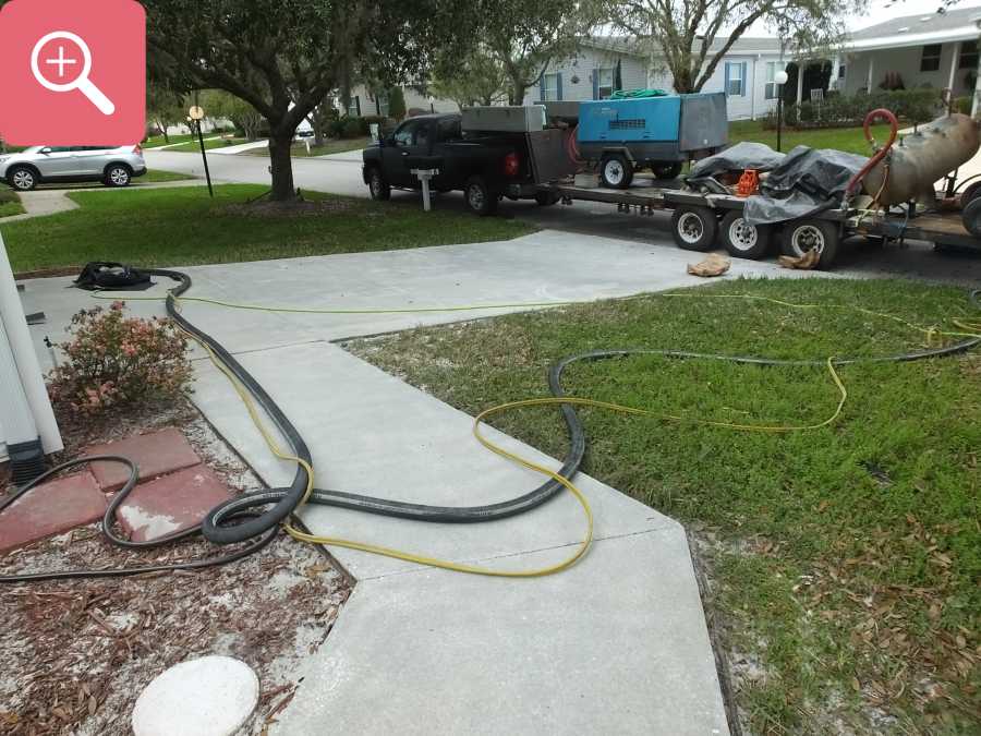 Sandblasting concrete driveway paint removal stripping