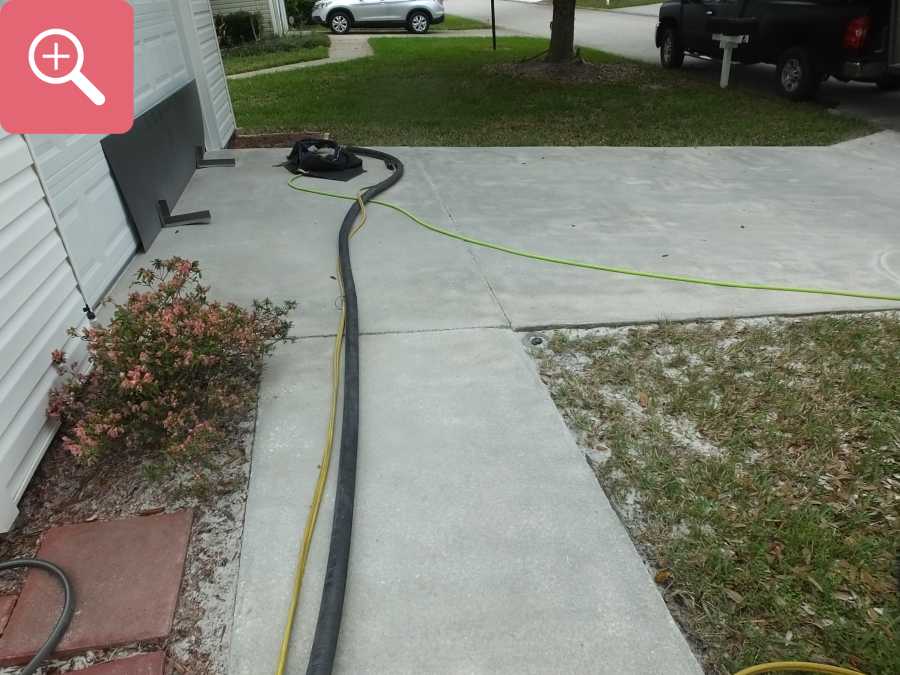 Sandblasting concrete driveway paint removal stripping