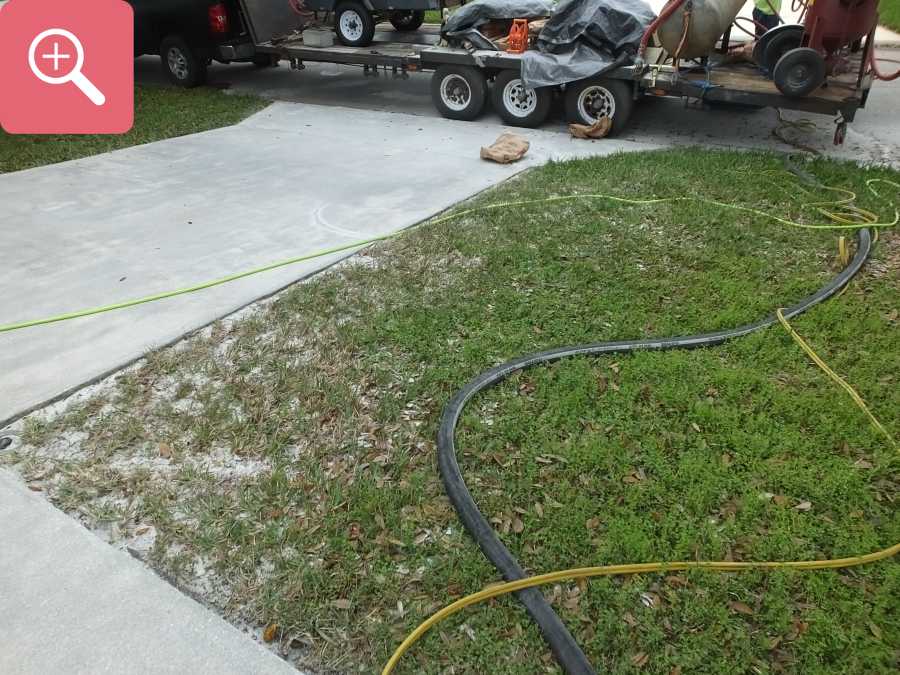 Sandblasting concrete driveway paint removal stripping