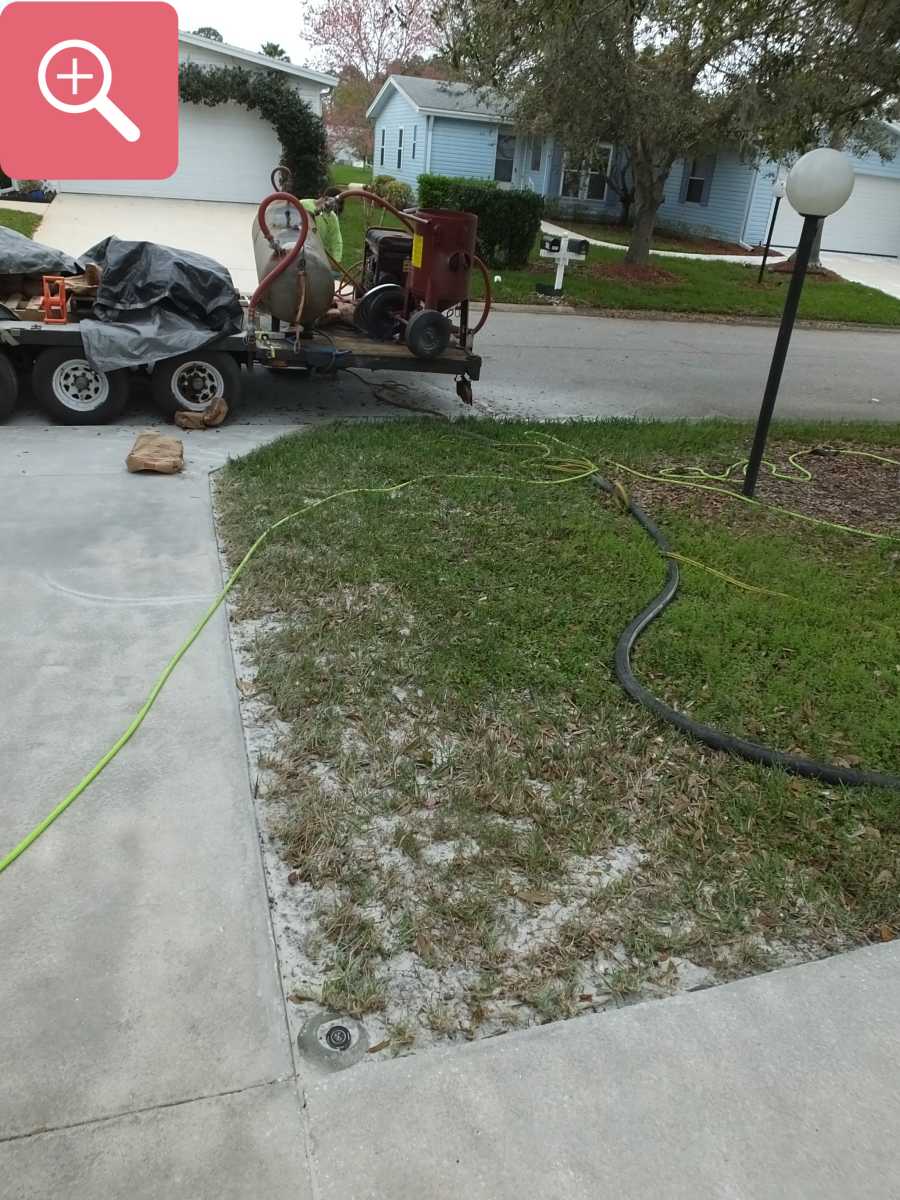 Sandblasting concrete driveway paint removal stripping