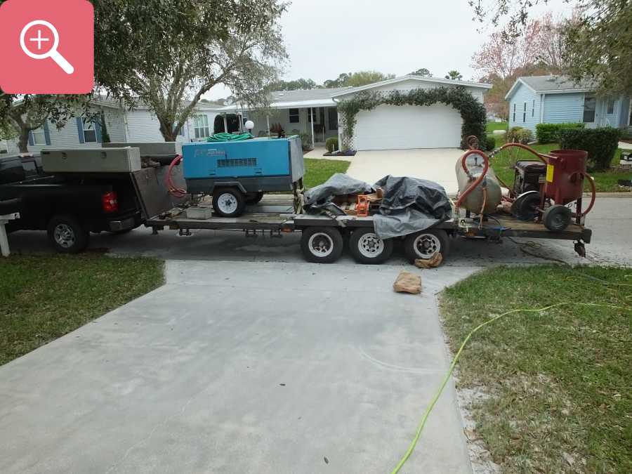 Sandblasting concrete driveway paint removal stripping