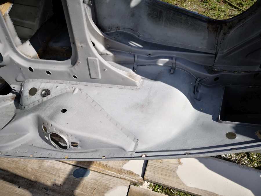 1972 auto being sandblasted