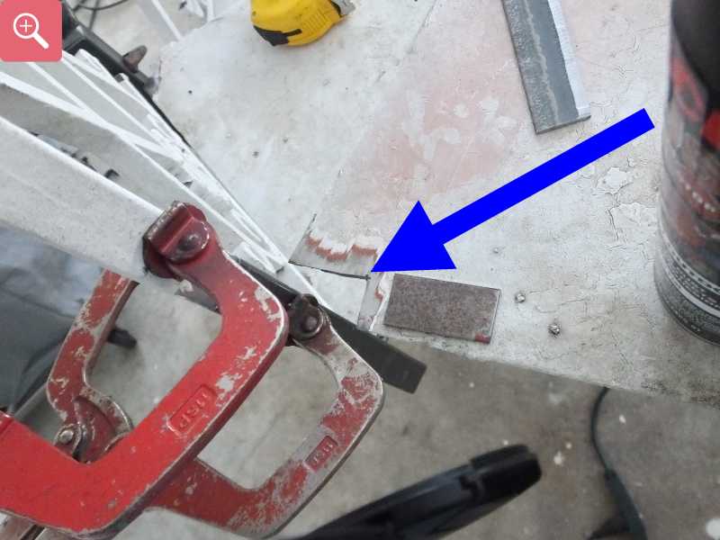 Cutting the rusty metal out of the stair case