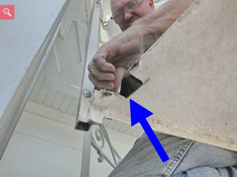 Cutting the rusty metal out of the stair case