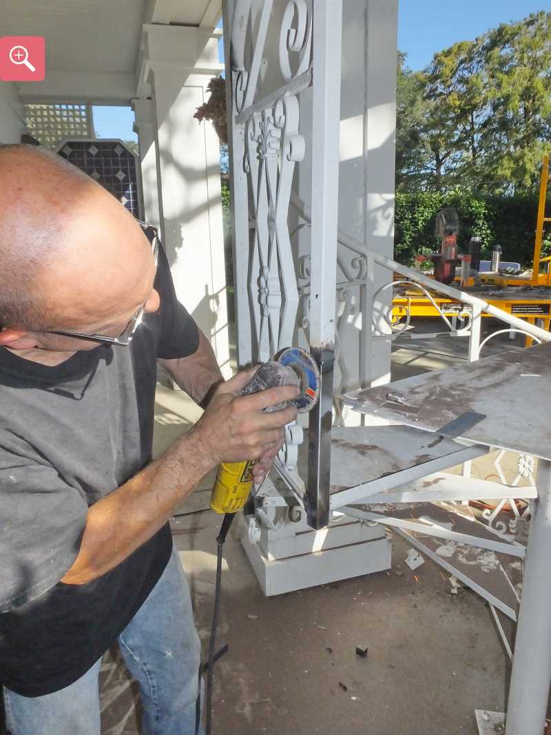 Grinding the welds smoot on the repaired staircase