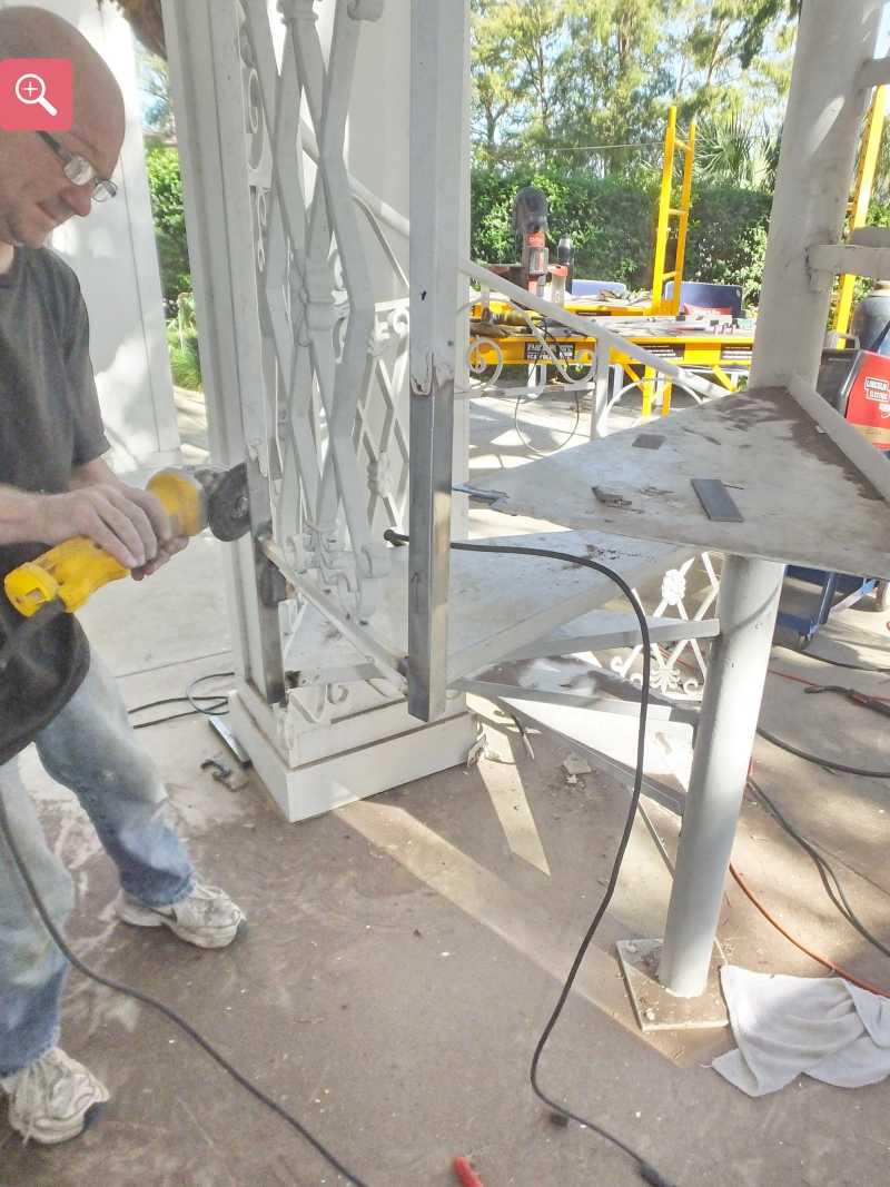 Grinding the welds smoot on the repaired staircase