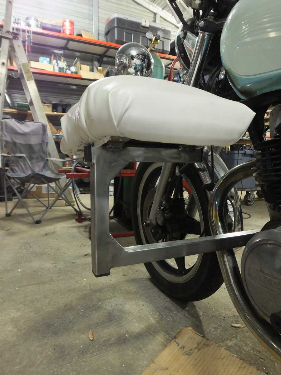 Stainless steel motocycle welding, leg rests and foot pegs. 