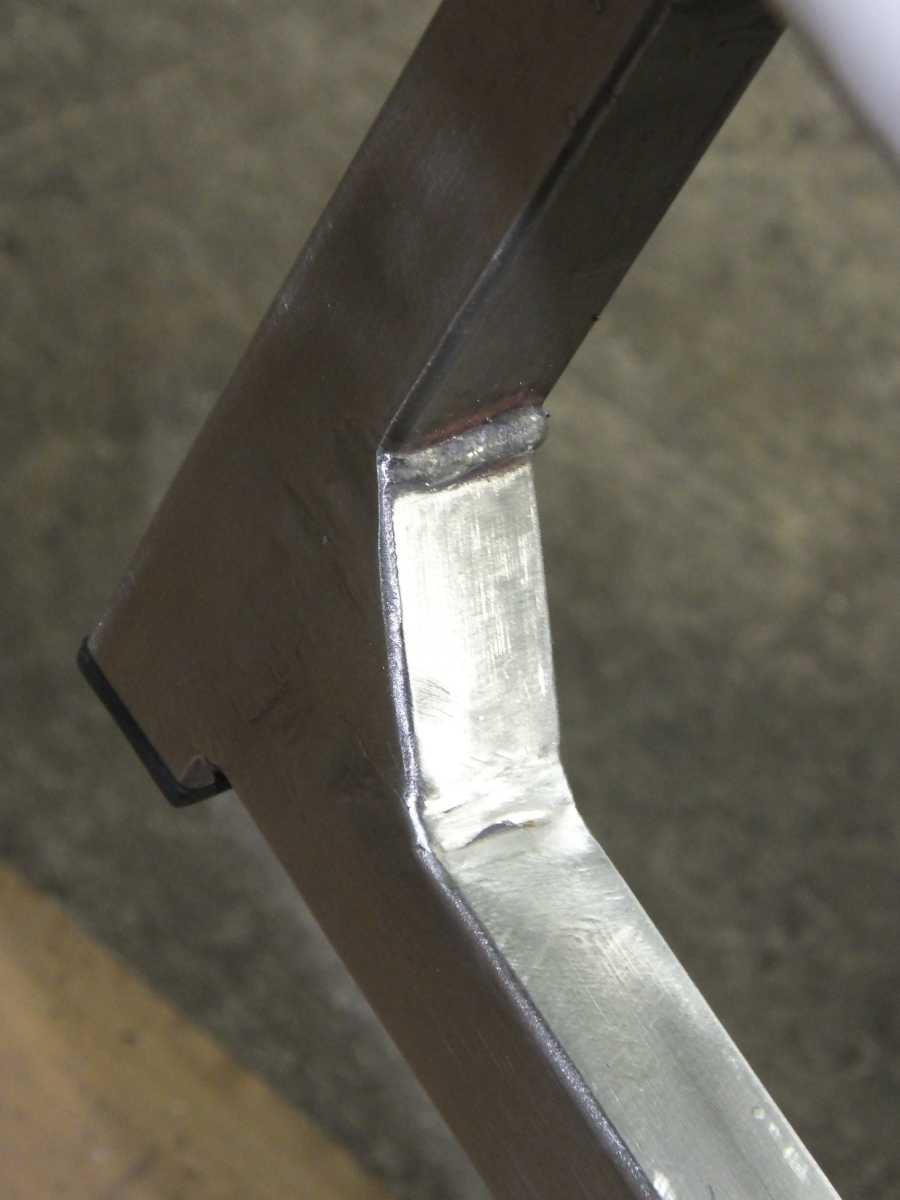 Stainless steel motocycle welding, leg rests and foot pegs. 