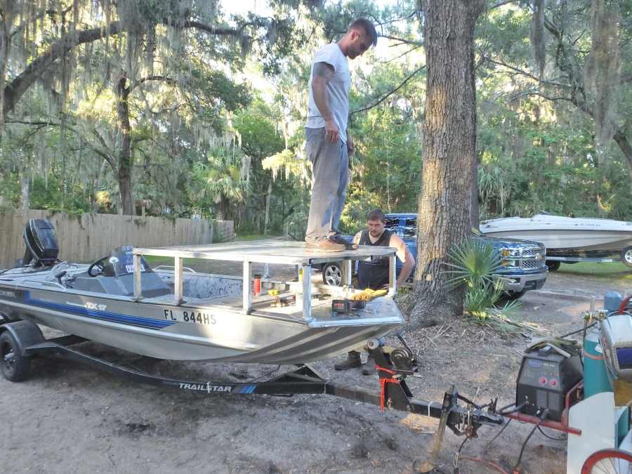 Welding, fabricating a bow fishing, gigging platform.