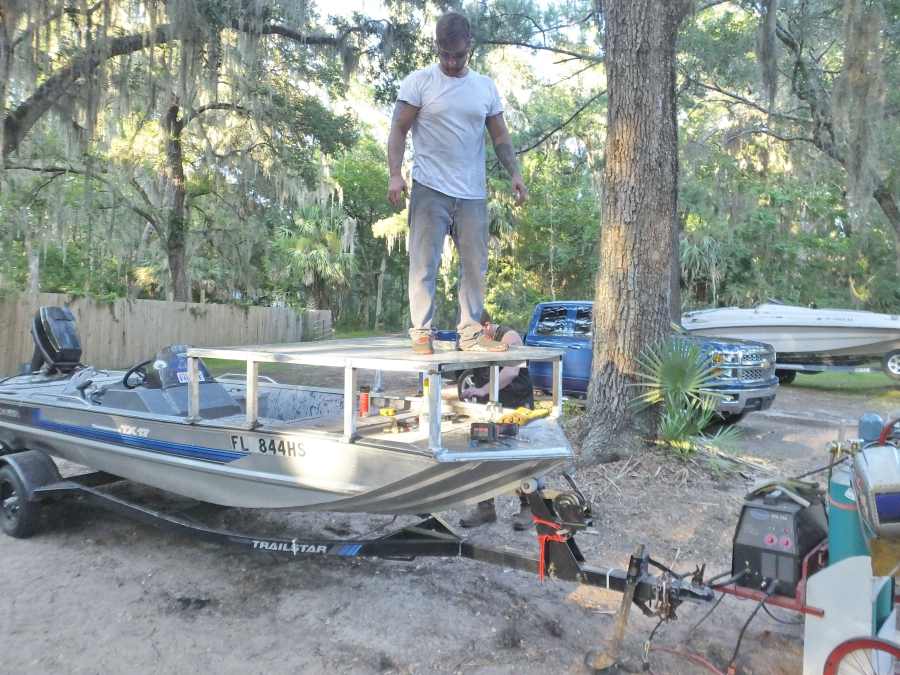 Welding, fabricating a bow fishing, gigging platform.