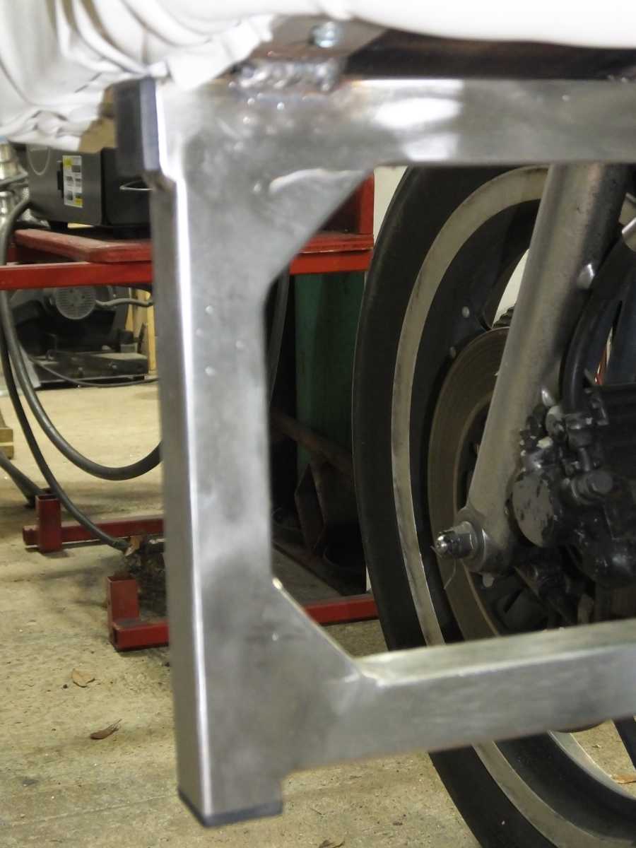 Stainless steel motocycle welding, leg rests and foot pegs. 