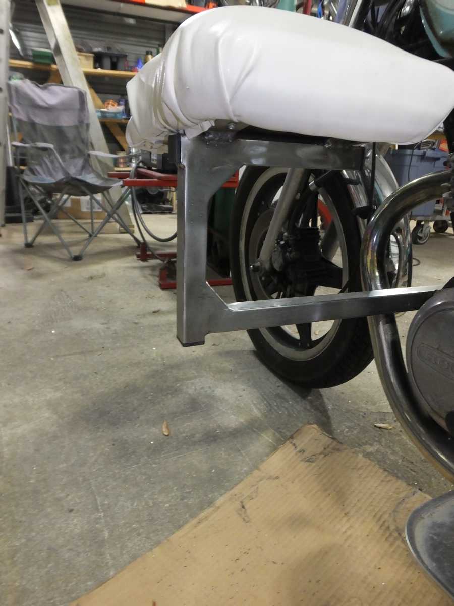 Stainless steel motocycle welding, leg rests and foot pegs. 